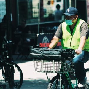 Photo Arabic products being delivered by a courier